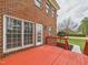 A side view of the red-painted wood deck at 1201 Clematis St, Knightdale, NC 27545