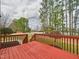 The spacious deck has a railing and stairs to the yard at 1201 Clematis St, Knightdale, NC 27545