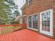 The deck offers a red painted wood surface and railing at 1201 Clematis St, Knightdale, NC 27545