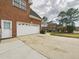 A paved driveway leads up to the white garage door at 1201 Clematis St, Knightdale, NC 27545