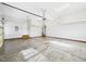 Spacious garage featuring grey walls, white ceiling, and concrete flooring at 1201 Clematis St, Knightdale, NC 27545