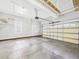 Clean and spacious garage with concrete floor and grey walls at 1201 Clematis St, Knightdale, NC 27545