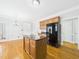 Open kitchen with an island, and views into the breakfast nook and dining room at 1201 Clematis St, Knightdale, NC 27545