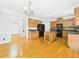 Traditional kitchen with wood cabinets, a center island, and black appliances at 1201 Clematis St, Knightdale, NC 27545