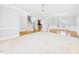 Open-concept living area featuring hardwood floors, staircase, and doorway to the kitchen at 1201 Clematis St, Knightdale, NC 27545