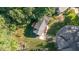 An aerial view of a charming home with a well-maintained yard and mature trees at 1224 Manchester Dr, Raleigh, NC 27609