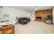 Finished basement with cozy seating area and brick fireplace, ideal for relaxing and entertaining guests at 1224 Manchester Dr, Raleigh, NC 27609