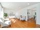 Bright living room with hardwood floors, neutral paint, and large windows offering ample natural light at 1224 Manchester Dr, Raleigh, NC 27609