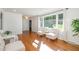 Inviting living room with hardwood floors and windows offering scenic views of the outdoors at 1224 Manchester Dr, Raleigh, NC 27609