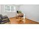 Bright office featuring hardwood floors, large window, modern wood desk, and comfortable seating at 1224 Manchester Dr, Raleigh, NC 27609