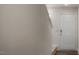 Bright entryway showcasing a white door, neutral walls, and carpeted stairs leading to the next level at 130 Carriedelle Ln, Smithfield, NC 27577