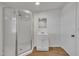 Updated bathroom includes a standing shower and laminate flooring at 1403 Fairground Road Rd, Dunn, NC 28334