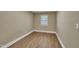 Cozy bedroom with a window providing natural light and laminate flooring at 1403 Fairground Road Rd, Dunn, NC 28334