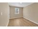 Bedroom features a window for natural light and laminate flooring at 1403 Fairground Road Rd, Dunn, NC 28334