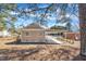 A tan house with a covered carport extending from the back side at 1403 Fairground Road Rd, Dunn, NC 28334