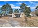 Charming single-Gathering home featuring a covered carport and mature trees in a quiet neighborhood at 1403 Fairground Road Rd, Dunn, NC 28334