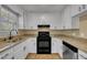A beautifully renovated kitchen awaits with a sleek new appliance and granite countertops at 1403 Fairground Road Rd, Dunn, NC 28334