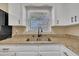 A double sink with a view of the backyard makes doing dishes a pleasure at 1403 Fairground Road Rd, Dunn, NC 28334