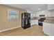Modern kitchen features stainless steel appliances, granite countertops, and ample natural light at 1403 Fairground Road Rd, Dunn, NC 28334