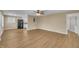 Open floorplan includes a kitchen with black refrigerator and laminate flooring throughout at 1403 Fairground Road Rd, Dunn, NC 28334