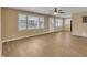 Spacious living room features laminate flooring, neutral walls, and multiple windows at 1403 Fairground Road Rd, Dunn, NC 28334