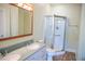 Bathroom features double sinks, large mirror, and glass shower at 159 Valhalla Dr, Timberlake, NC 27583