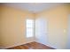 Bedroom featuring a window providing natural light, yellow walls, and hardwood floors at 159 Valhalla Dr, Timberlake, NC 27583