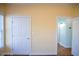 Bedroom features hardwood floors and yellow walls, with an open door to a hallway at 159 Valhalla Dr, Timberlake, NC 27583