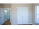 Comfortable bedroom with hardwood floors, natural light, and spacious closet at 159 Valhalla Dr, Timberlake, NC 27583