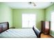 Bright bedroom features hardwood floors, ceiling fan, large window and neutral paint at 159 Valhalla Dr, Timberlake, NC 27583