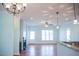 Dining room with hardwood floors, chandelier, and French doors leading to the backyard at 159 Valhalla Dr, Timberlake, NC 27583
