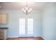 Dining room featuring French doors leading to a large backyard with manicured lawn at 159 Valhalla Dr, Timberlake, NC 27583