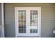 White double doors with glass panels, and a view of the porch's exterior at 159 Valhalla Dr, Timberlake, NC 27583