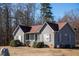 Inviting single-story home featuring a covered front porch and mature landscaping in a serene setting at 159 Valhalla Dr, Timberlake, NC 27583