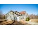 A single-story home with gray siding, an attached garage, and well-maintained landscaping at 159 Valhalla Dr, Timberlake, NC 27583