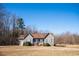 A charming single-story home with gray siding, a front porch, and well-maintained landscaping at 159 Valhalla Dr, Timberlake, NC 27583