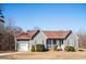 Charming single-story home featuring gray siding, a covered porch, and manicured landscaping at 159 Valhalla Dr, Timberlake, NC 27583