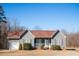 Charming single-story home with gray siding, a covered porch, and manicured landscaping at 159 Valhalla Dr, Timberlake, NC 27583