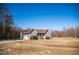 A charming single-story home with gray siding, a front porch, and well-maintained landscaping at 159 Valhalla Dr, Timberlake, NC 27583