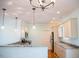 Bright kitchen with hardwood floors, granite countertops, pendant lighting, and modern appliances at 159 Valhalla Dr, Timberlake, NC 27583