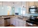 Kitchen featuring a stainless steel dishwasher, granite countertops, and white cabinets at 159 Valhalla Dr, Timberlake, NC 27583