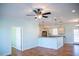 Open kitchen with hardwood floors, granite countertops, pendant lighting, and modern appliances at 159 Valhalla Dr, Timberlake, NC 27583