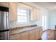 Kitchen with stainless steel appliances, granite countertops, window, and white cabinets at 159 Valhalla Dr, Timberlake, NC 27583