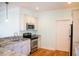 Kitchen featuring stainless steel appliances, granite countertops, and white cabinets at 159 Valhalla Dr, Timberlake, NC 27583