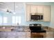 Close-up of the kitchen with stainless steel appliances and granite countertops at 159 Valhalla Dr, Timberlake, NC 27583