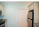 Kitchen with stainless steel refrigerator and door to pantry at 159 Valhalla Dr, Timberlake, NC 27583