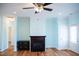 Living area featuring hardwood floors, a fireplace, and access to the backyard at 159 Valhalla Dr, Timberlake, NC 27583