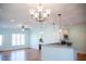 Open layout features a breakfast bar with granite countertops, adjacent to the living and dining areas at 159 Valhalla Dr, Timberlake, NC 27583