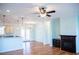 Living area featuring hardwood floors, a fireplace, and open to the kitchen with granite countertop at 159 Valhalla Dr, Timberlake, NC 27583