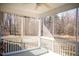 Relaxing screened-in porch with ceiling fan and a serene view of trees at 159 Valhalla Dr, Timberlake, NC 27583